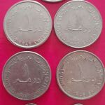 ΗΠΑ 1/4 Δολάριο 1979 και 6 νομίσματα των Ηνωμένων Αραβικών Εμιράτων.