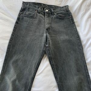 Levis jeans 550   W32L30. cropped. made in the USA