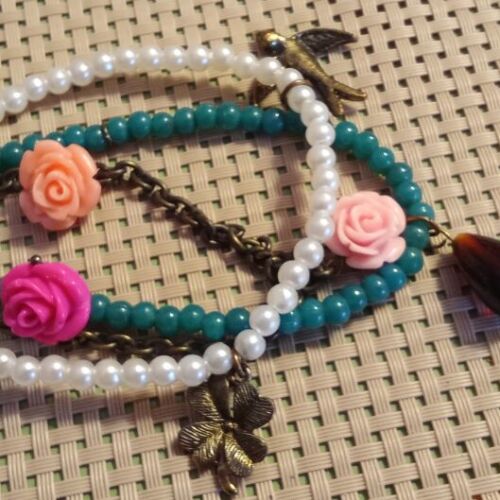 Handmade bracelet with pearls, turquoise beads and charms