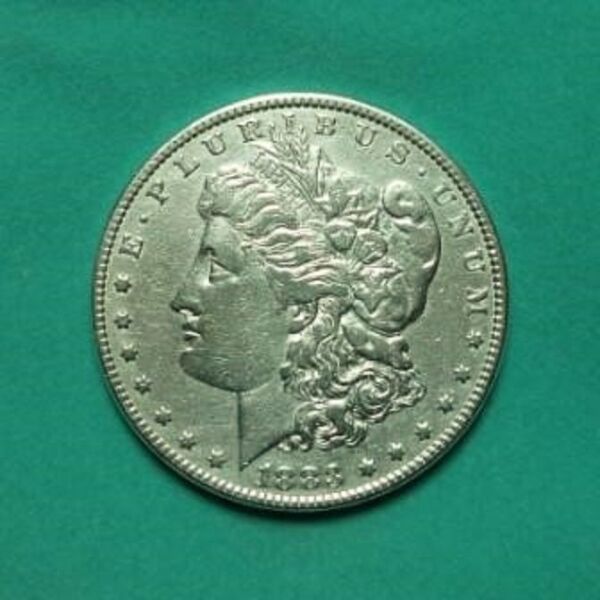 1883 asimenio amerikaniko dolario . Morgan Dollar .