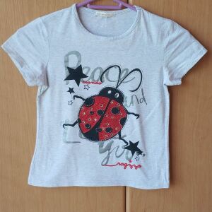 Καλοκαιρινή μπλούζα για κορίτσι 9-10 ετών σε χρώμα ανοιχτό γκρι σε άριστη κατάσταση.